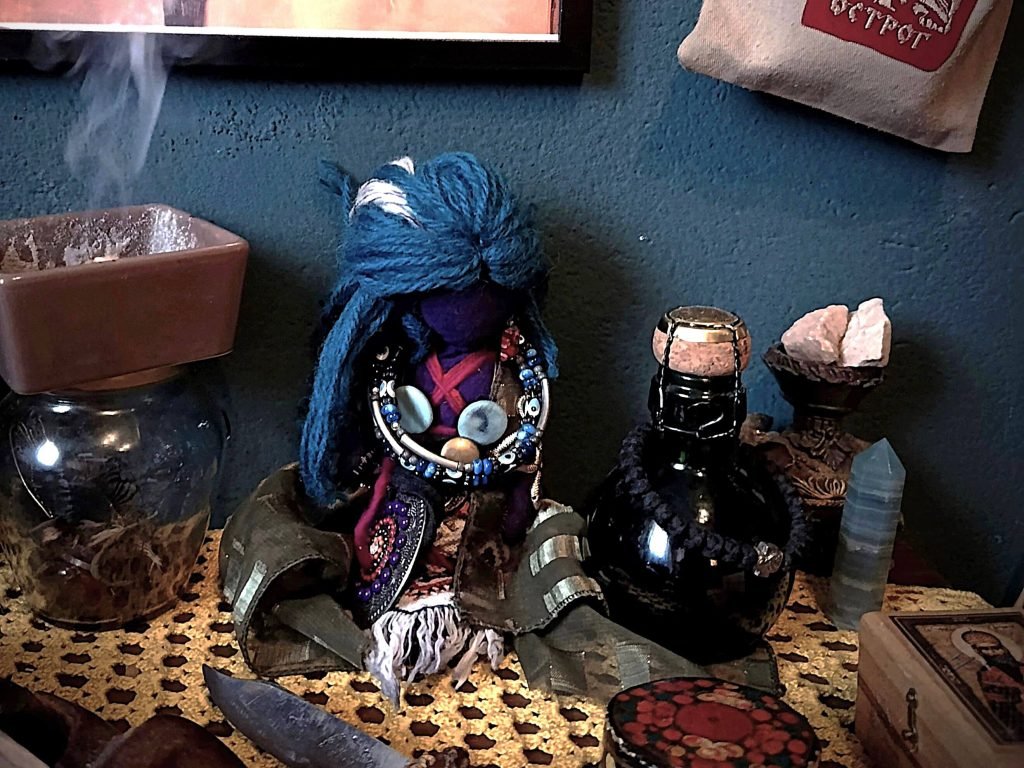 Personal altar featuring symbolic objects, ritual tools, and devotional items.
