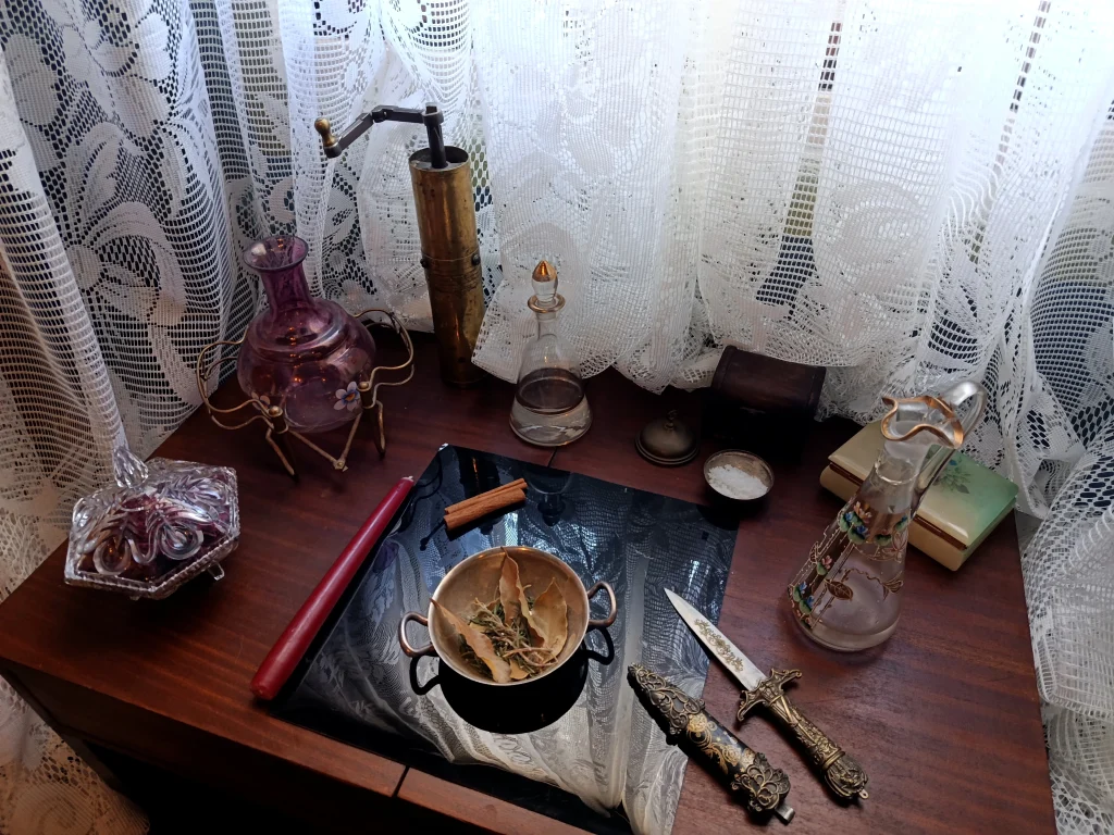 Arrangement of symbolic objects and ritual tools within a personal practice space.