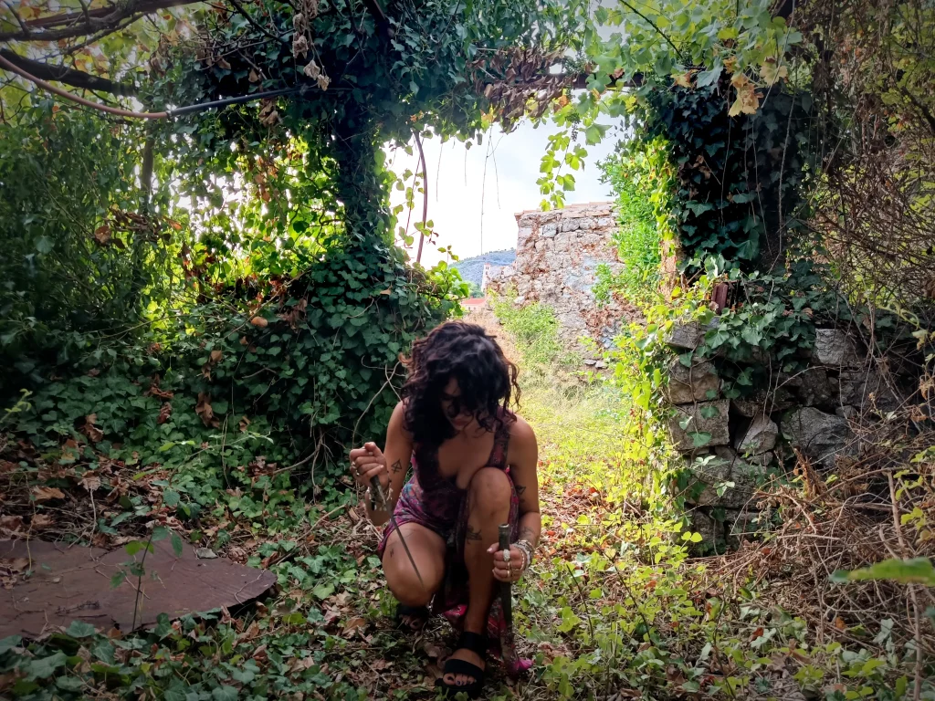 Figure in a natural landscape reflecting themes of contemplation, symbolism, and connection to place.