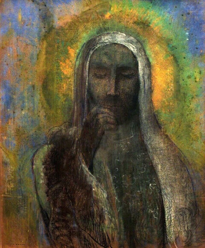Veiled Christ with lowered eyes and a hand raised to his lips, surrounded by a yellow halo against a muted blue background.