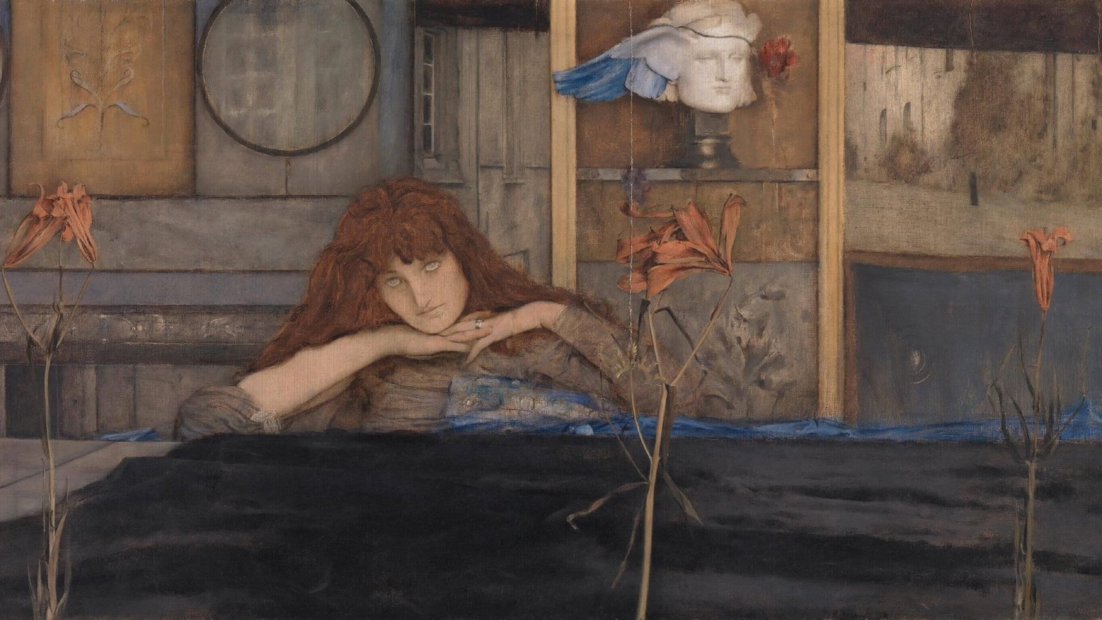 Red-haired woman resting her chin on her hands behind orange flowers, with a winged sculpted head in the background.