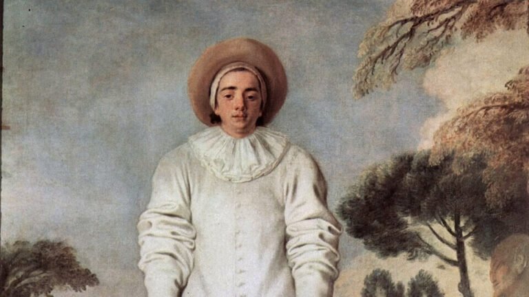 A man in a loose white theatrical costume stands facing the viewer, with other costumed figures and trees behind him.